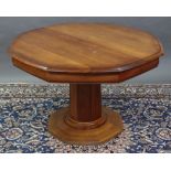 An “ESIGENCE” (Made in France) cherry wood octagonal extending dining table with two additional