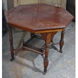 A late Victorian mahogany centre table, with moulded edge to the octagonal top, & on ring-turned