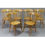 A set of six solid beech slat-back dining chairs with hard seats & on ring turned legs.