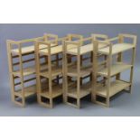 Four beech folding shelving units, each fitted three shelves, 27½” wide x 37” high x 11½” deep (