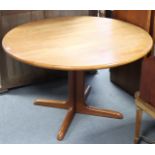 A modern teak circular extending dining table, with pull-out mechanism & two additional leaves, on
