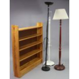 A pine standing bookcase, 46” wide x 53¼” high x 8¼” deep; together with two standard lamps; & a