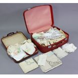 Various items of household linen & textiles contained in two suitcases.