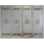 A set of four early-mid 20th century “CADBURY’S CHOCOLATE” glass panels, 21½” x 6¾”.