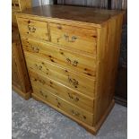 A modern pine chest, with moulded edge to the plain rectangular top, fitted two short & three long
