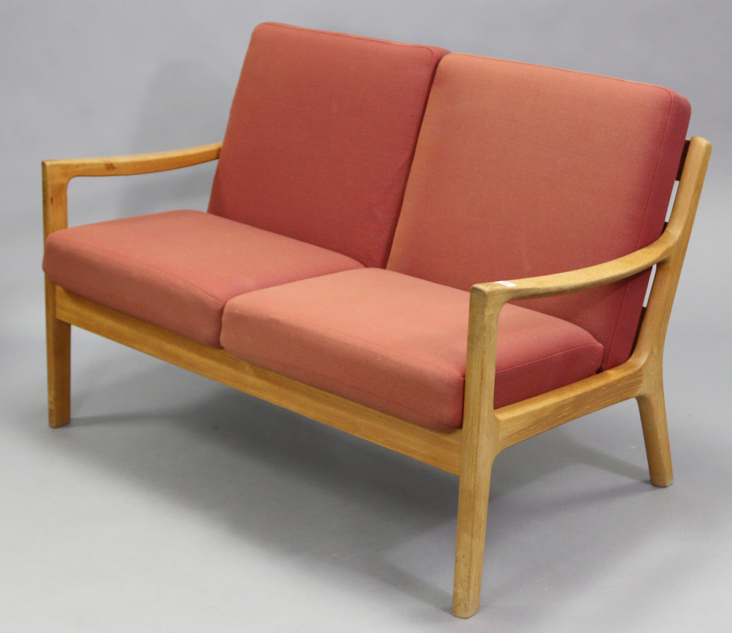 A Danish teak two seater settee by P. Joppensen Furniture, with removable seat cushions; 49½” wide x