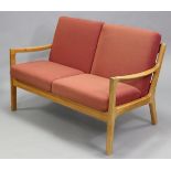 A Danish teak two seater settee by P. Joppensen Furniture, with removable seat cushions; 49½” wide x