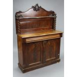 A Victorian mahogany chiffonier with stage back & shelf, on turned supports, fitted single frieze