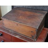 An early 20th century pine clerk’s sloping-front table top desk, 26½” wide.