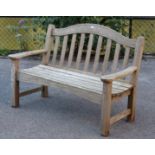 A “SWAN HATTERSLEY” teak garden bench with shaped splat back & hard slatted seat, on square legs,