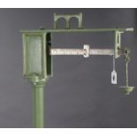 A Walter Parry & Sons of London cast-iron platform scale, to weigh 7lb, painted in green with gold