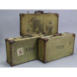 Three canvas-covered & leather-bound suitcases, two with initials: “V.C.S.” & “E. B. A.”.