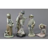 Four various Lladro figures: “Boy Fishing”, 8¾” high, “Following Her Cats”, 9½” high, “Yawning