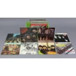 Sixty various L. P. records including The Beatles, David Bowie, The Rolling Stones, Queen, etc.