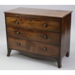 A GEORGE III MAHOGANY RECTANGULAR CHEST with reeded edge, fitted brushing slide above three long