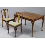 A reproduction Queen Anne-style burr walnut dining table, the rectangular top with sliding mechanism