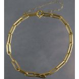 A yellow metal flexible bracelet of plain elongated links, with Middle-Eastern control mark &