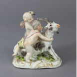 AN 18th century MEISSEN PORCELAIN GROUP OF TWO PUTTI TAMING A GOAT, each infant partially clad in