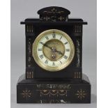 A Victorian mantel clock in black slate case with gilt decoration, the two-part dial with cream
