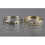 A 9ct. gold ring set row of seven small diamonds, size: N; weight: 2.6gm; & a similar 9ct. white