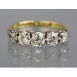 A FIVE-STONE DIAMOND RING, the graduated cushion-shaped stones set to an 18ct. & platinum shank, the