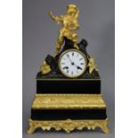 A 19th century French mantel clock in ebonised & gilt speltre case with figural surmount depicting a