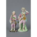 An 18th century Derby porcelain standing figure of a boy wearing colourful costume, a small dog