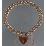 A 9ct. gold curb-link bracelet with padlock clasp; approx. 7¼” long. (11.8gm).