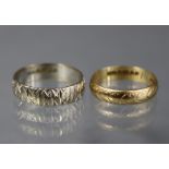 An 18ct. engraved white gold band, size: M/N, weight: 3.4gm; & a 9ct. yellow gold ditto, size: L;