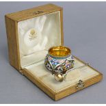 A Russian silver-gilt & cloisonné enamel salt cellar of squat round form, decorated with stylised