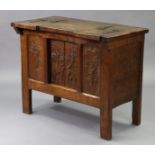 A CRAFTSMAN-MADE SOLID JOINED OAK DWARF CABINET, the top with two sliding hinged lids above a