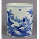 A Chinese blue-&-white porcelain cylindrical brush pot, decorated with figures in a mountainous