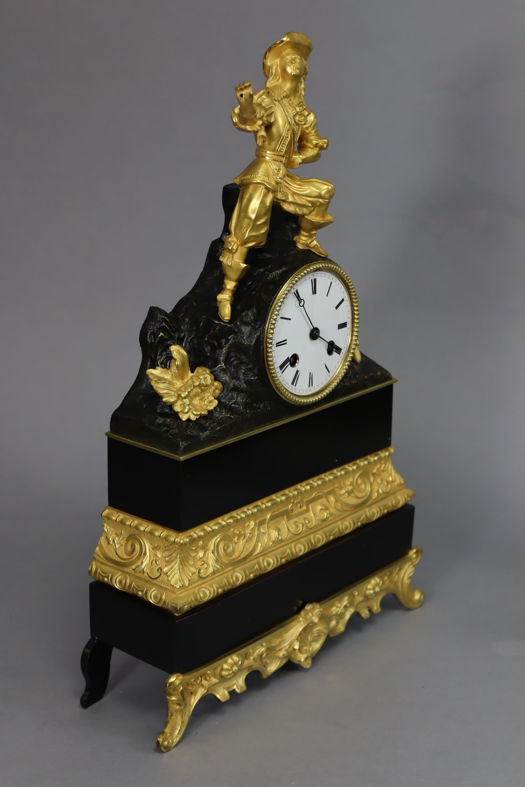 A 19th century French mantel clock in ebonised & gilt speltre case with figural surmount depicting a - Image 2 of 4