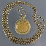 A Swiss 10 Franc gold coin, 1915, mounted as a pendant, on long chain necklace. (The mount & chain