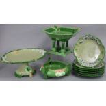An Eichwald lilac, green, & olive-glazed pottery dessert service with Art Nouveau floral