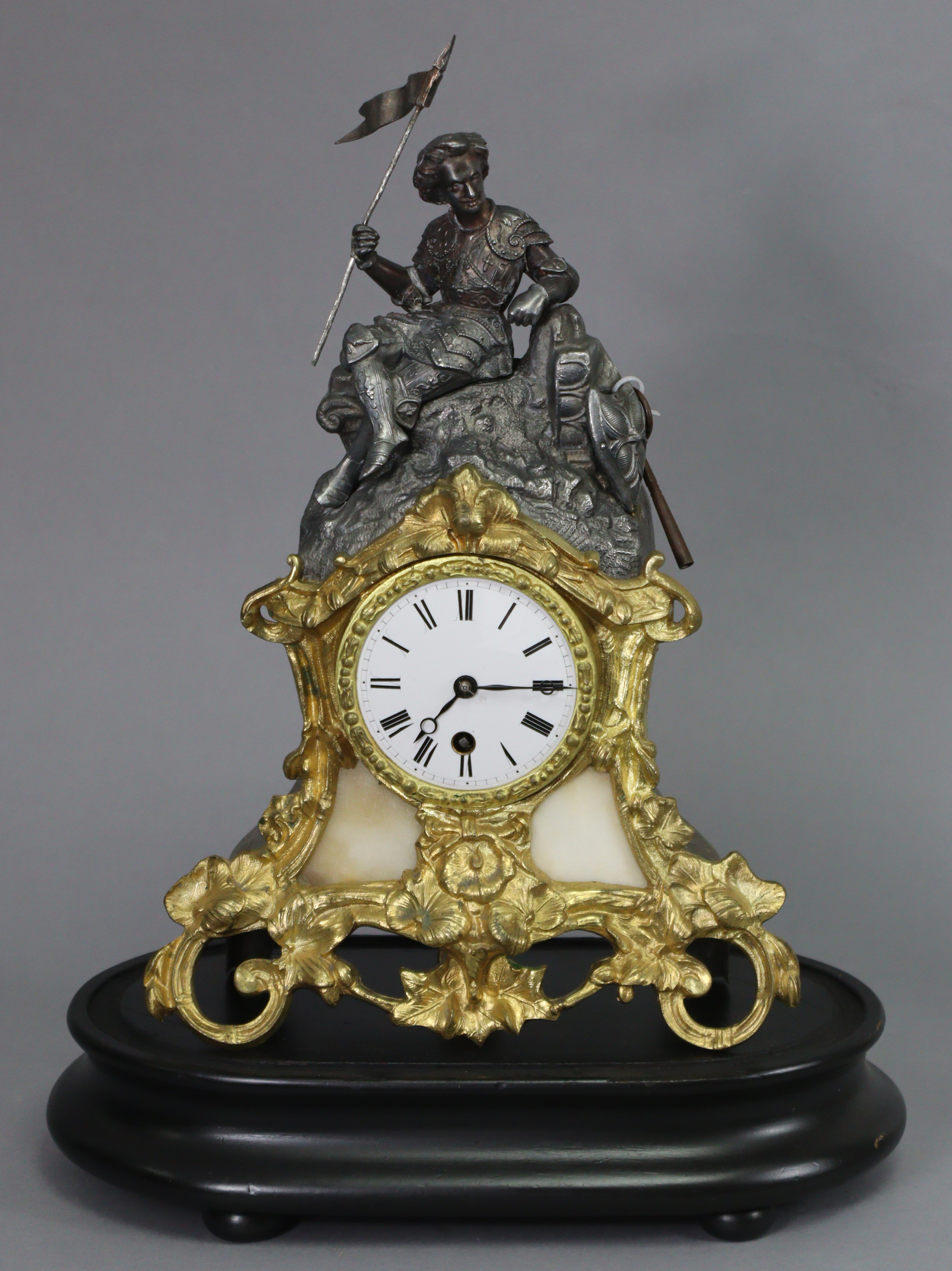 A 19th century French mantel clock in speltre figural case with pierced gilt-metal rococo style