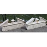 A pair of modern white-painted wooden architectural broken-arch pediments with moulded classical