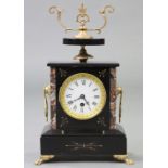 A Victorian mantel clock in black slate & rouge marble case, with gilt-metal mounts, 3½” diam. white