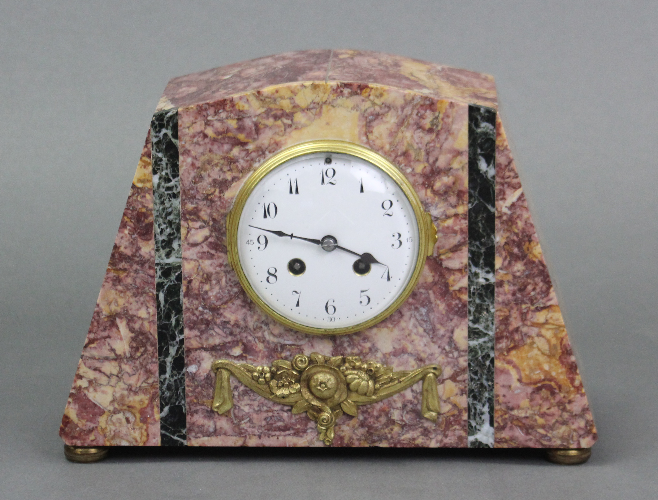 A French Art Deco mantel clock in pink & green marble case, the 4¼” diam. white enamel dial with