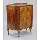 A 1960’s mahogany side cabinet with rounded ends, fitted two shelves enclosed by centre panel