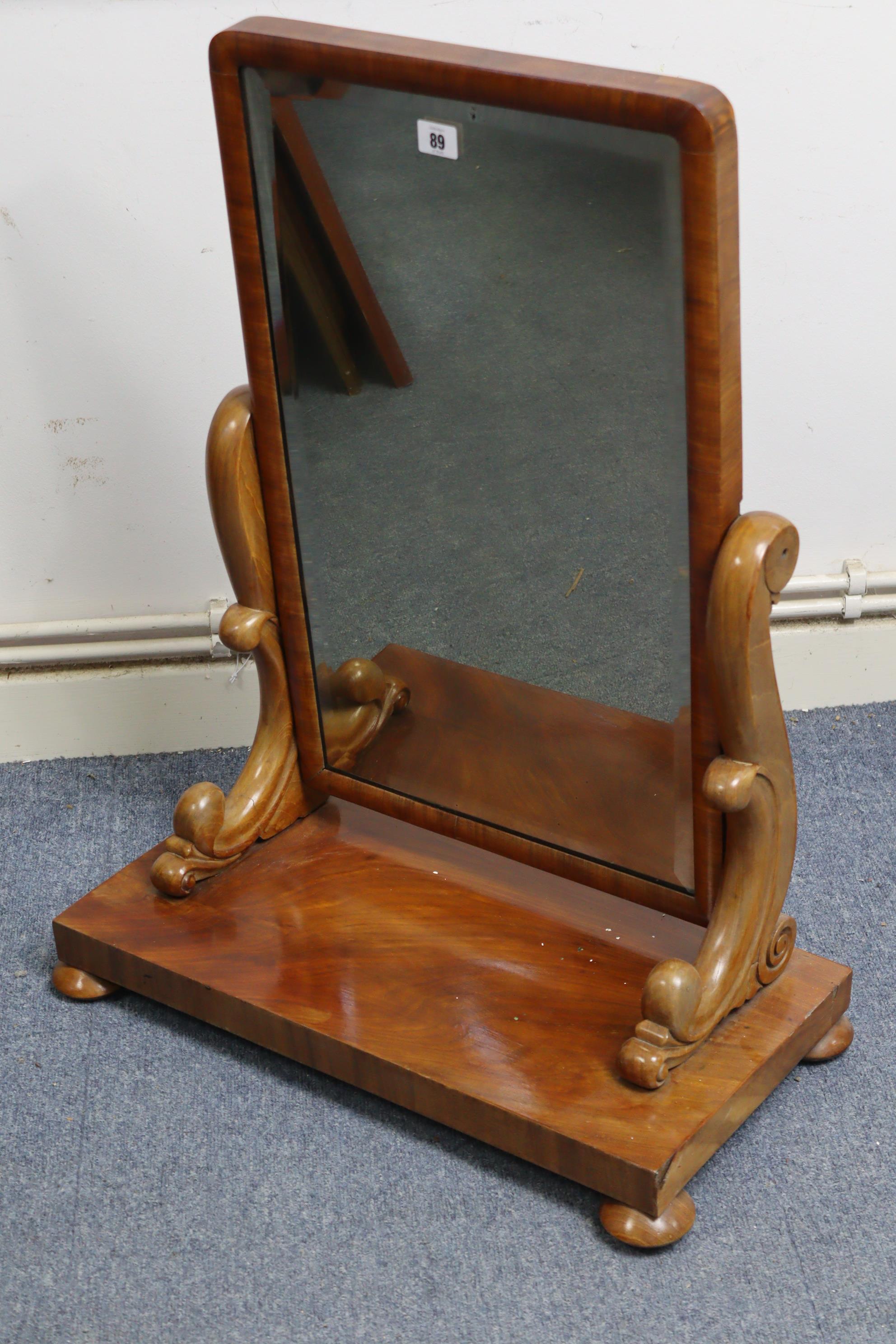 A 19th century mahogany rectangular swing toilet glass inset bevelled plate, with scroll supports, &