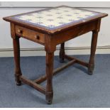 A pine kitchen table inset tiles to the rectangular top, fitted drawer to either end, & on four