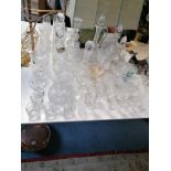 Seven various cut-glass decanters, two with silver decanter labels; together with various other