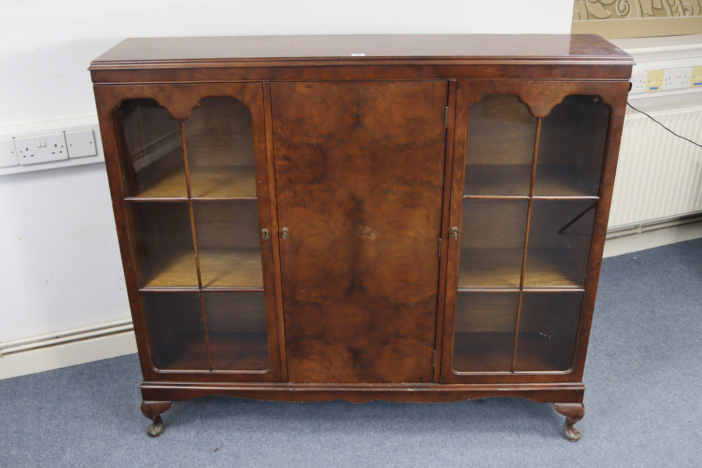 A mid-20th century walnut bookcase, with six adjustable shelves enclosed by panel door to centre - Image 3 of 3