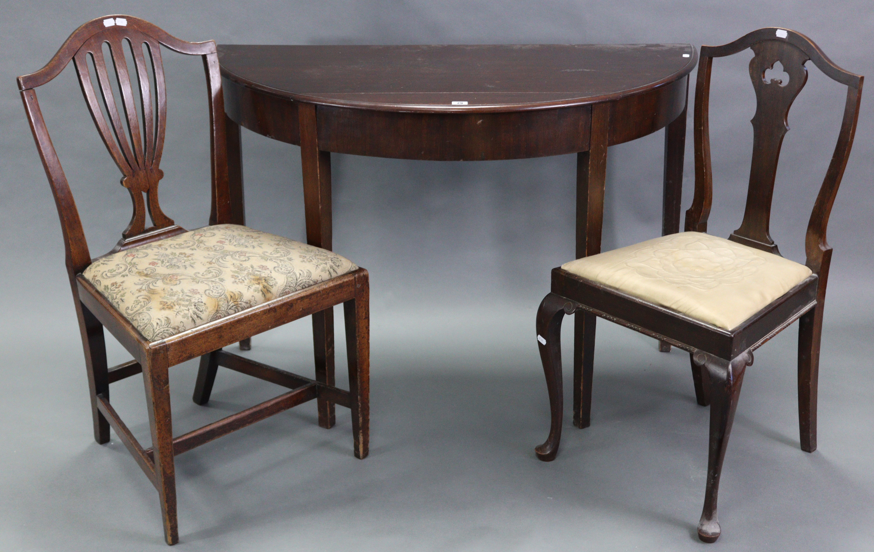 A mahogany demi-lune side table, with moulded edge & on four square tapered legs, 44½” wide x 30½”