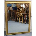 A large gilt frame rectangular wall mirror, inset bevelled plate (slight faults), 54” x 41”;