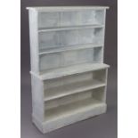 A white painted pine standing open bookcase of five open tiers, & on plinth base, 38” wide x 54¼”