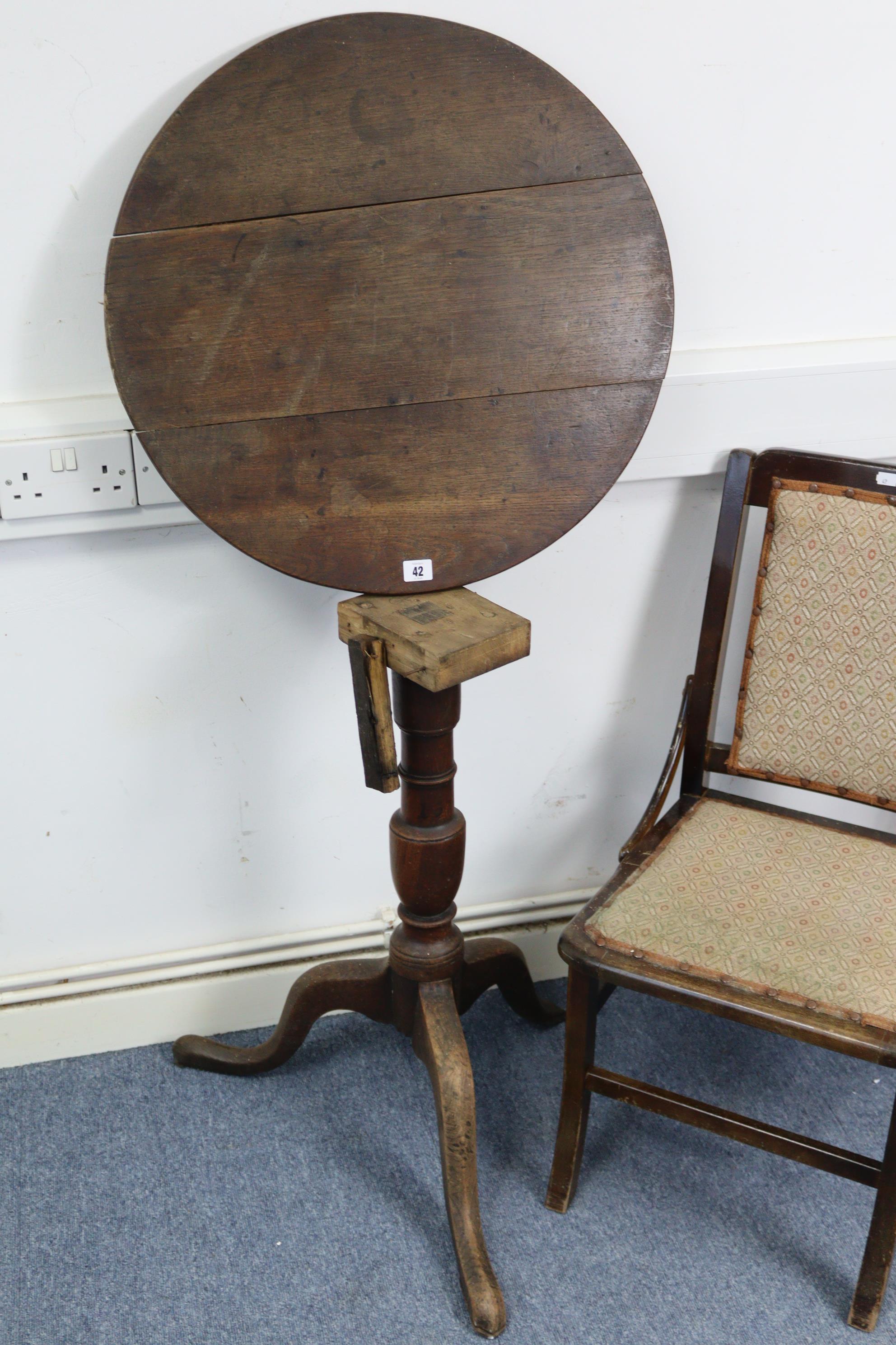 A 19th century oak tripod table with circular top, & on vase-turned centre column & three cabriole - Image 2 of 5