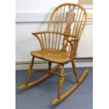 A Victorian-style ash rocking chair with pierced & shaped centre splat, with hard seat, & on