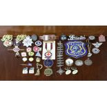 Various enamelled badges, buttons, stick pins, etc.